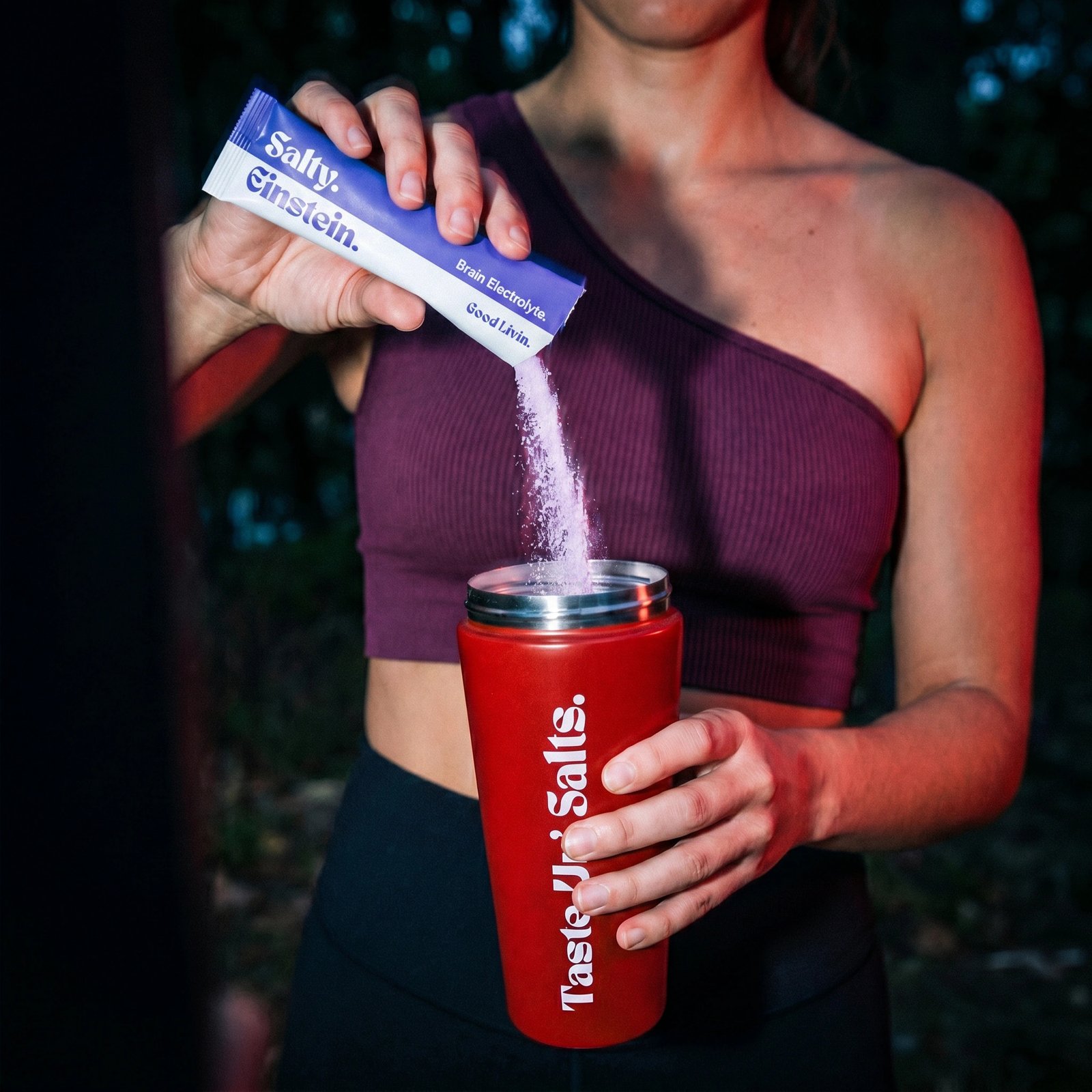 Good Livin' creator pouring Salty Einstein outdoors